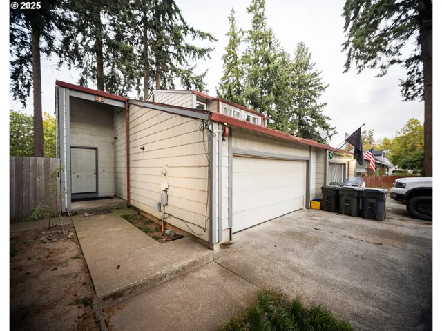 a view of a house with a yard and garage