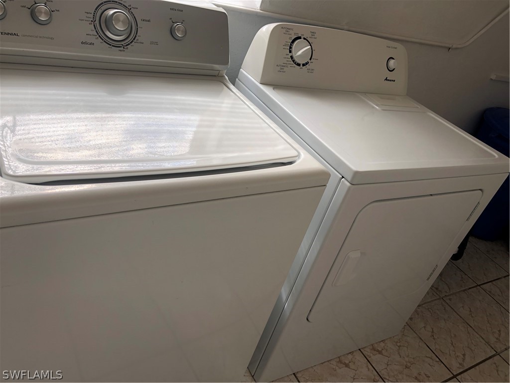 208 Davis Road Lehigh Acres, FL 33936 - Photo 11 of 20 a close up view of washer and dryer