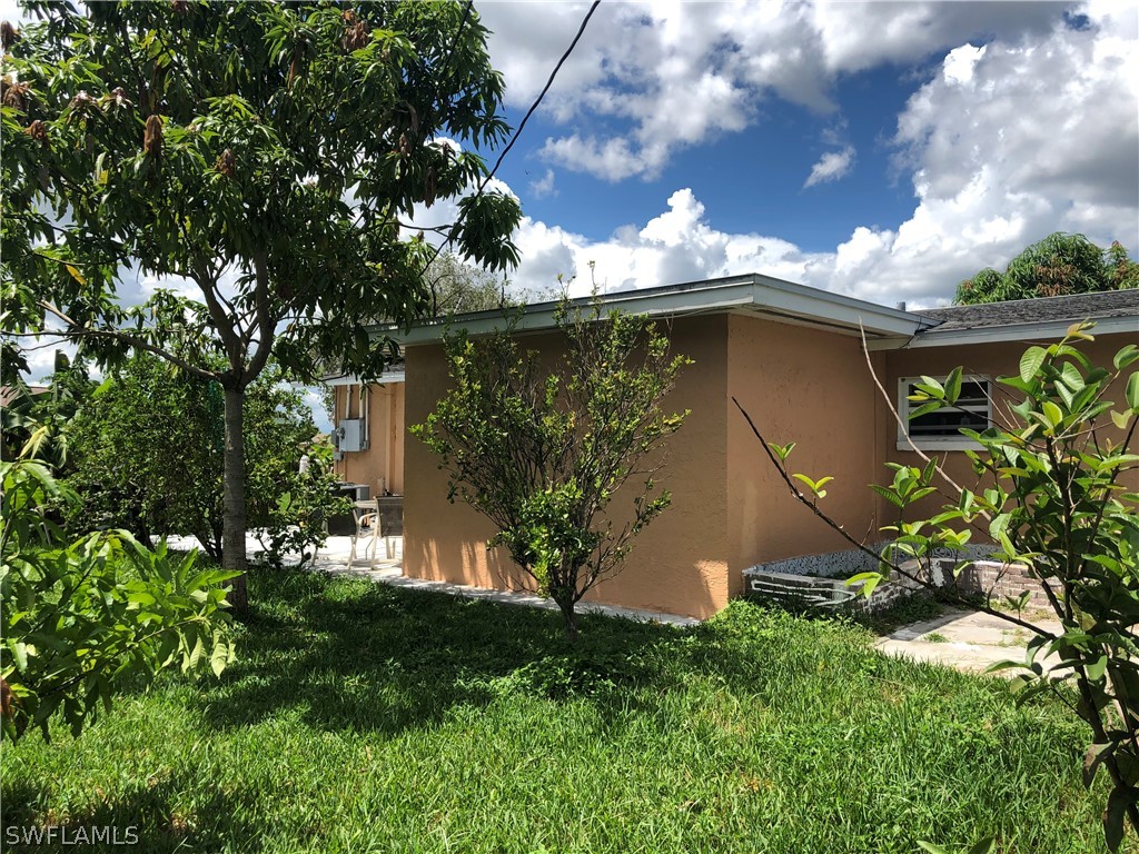 208 Davis Road Lehigh Acres, FL 33936 - Photo 7 of 20 a view of a backyard