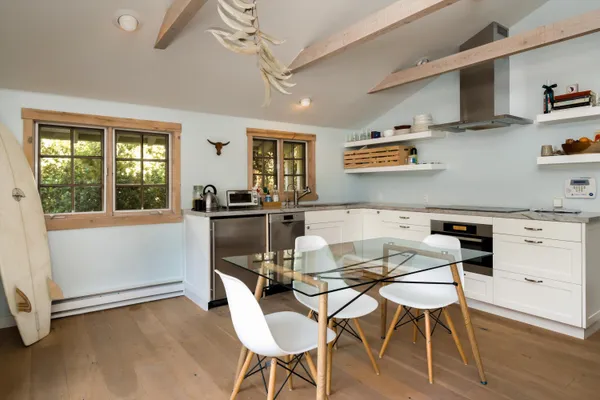 a dining room with furniture and window