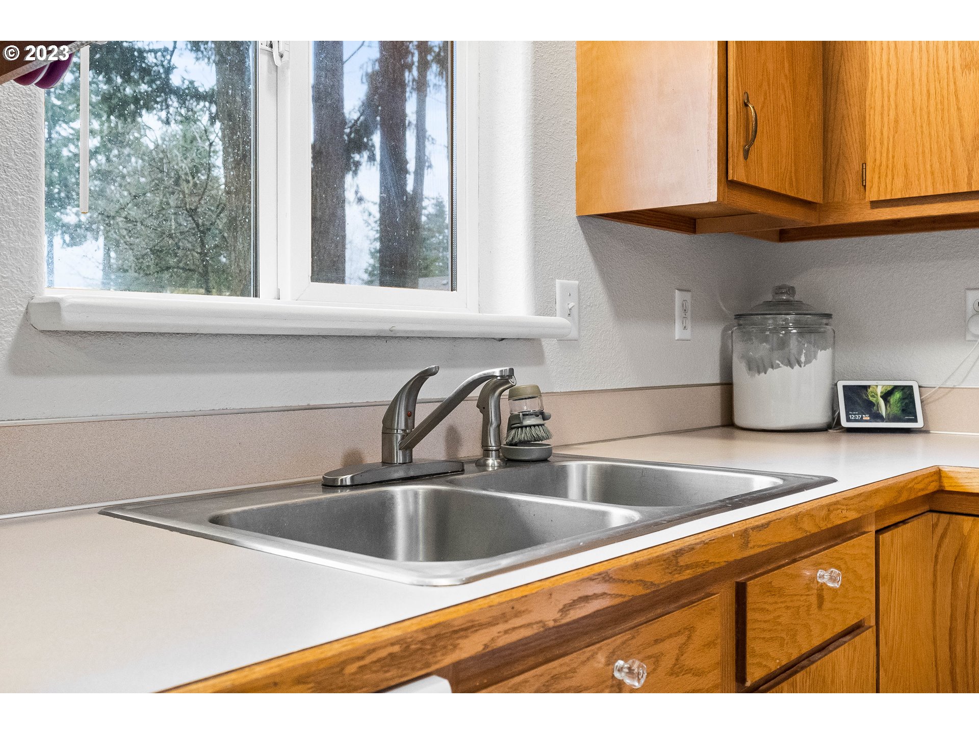 1484 Wiltsey Road Southeast Salem, OR 97306 - Photo 19 of 31 a kitchen with stainless steel appliances granite countertop a sink and a white cabinets