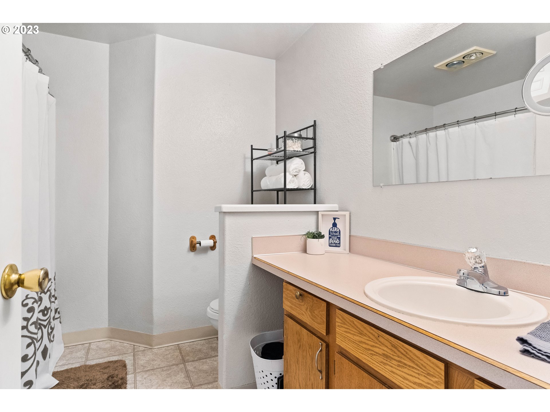 1484 Wiltsey Road Southeast Salem, OR 97306 - Photo 21 of 31 a bathroom with a sink and a mirror