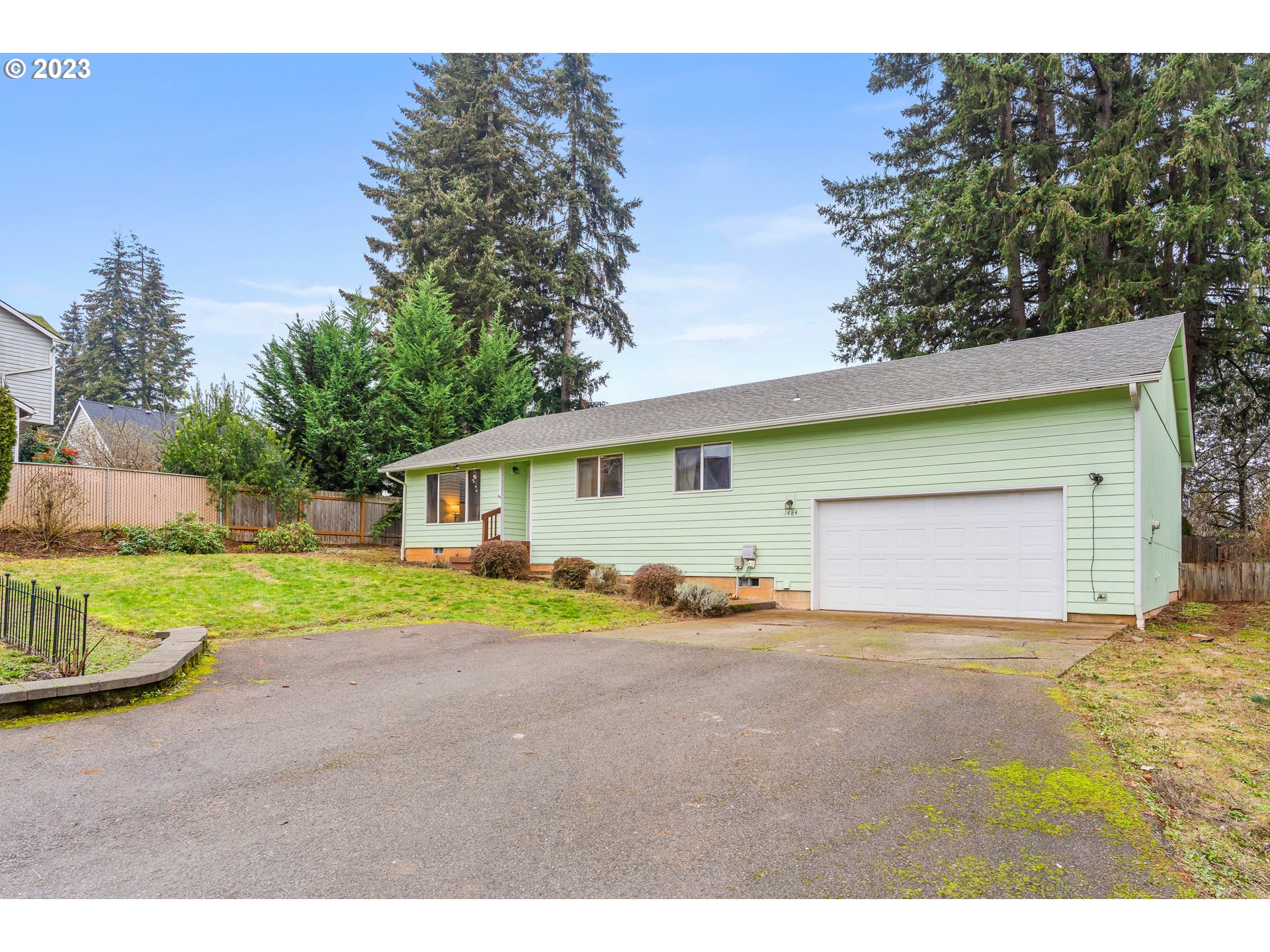 1484 Wiltsey Road Southeast Salem, OR 97306 - Photo 26 of 31 a front view of a house with a yard and garage