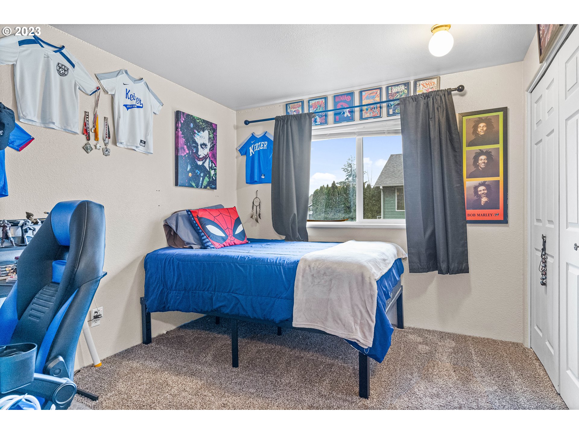 1484 Wiltsey Road Southeast Salem, OR 97306 - Photo 10 of 31 a bedroom with a bed dresser and a large window
