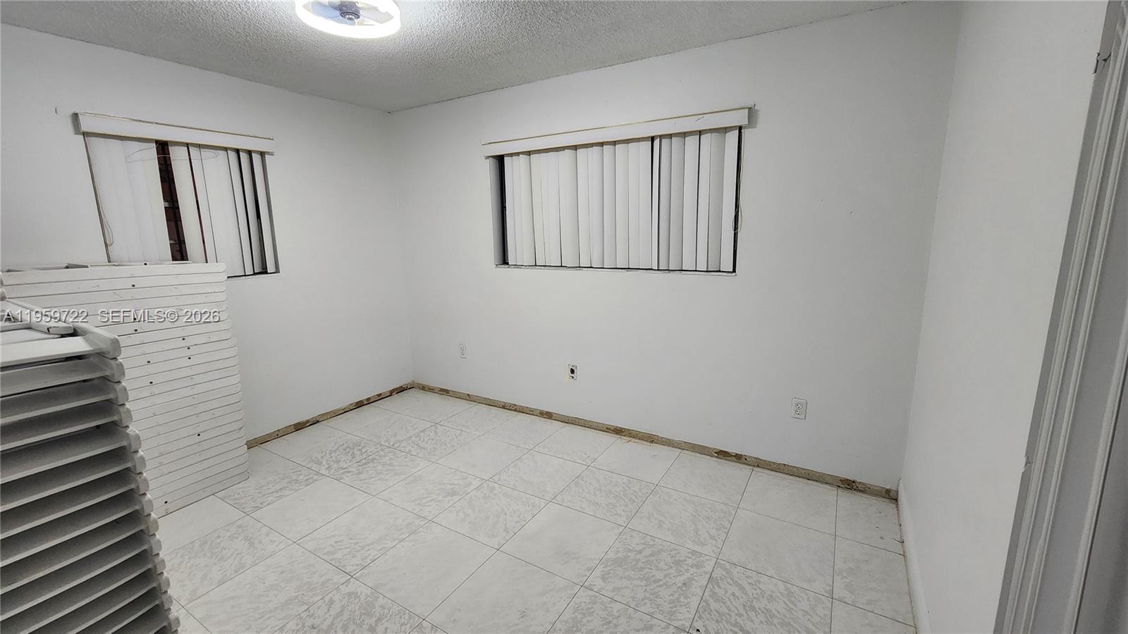 20022 Southwest 118th Avenue Miami, FL 33177 - Photo 11 of 23 a view of an empty room