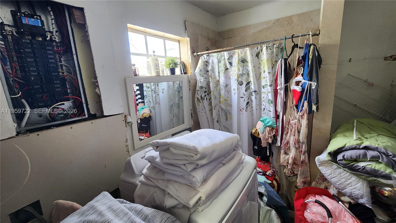 20022 Southwest 118th Avenue Miami, FL 33177 - Photo 15 of 23 a living room with furniture and a closet
