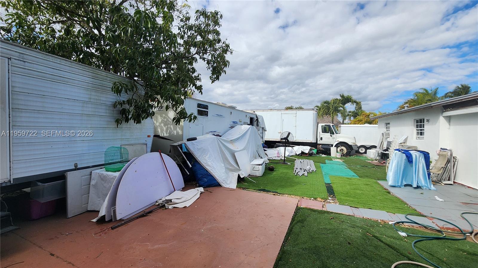 20022 Southwest 118th Avenue Miami, FL 33177 - Photo 19 of 23 a view of a house with a patio