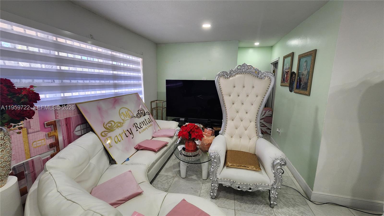 20022 Southwest 118th Avenue Miami, FL 33177 - Photo 2 of 23 a living room with furniture and a chandelier