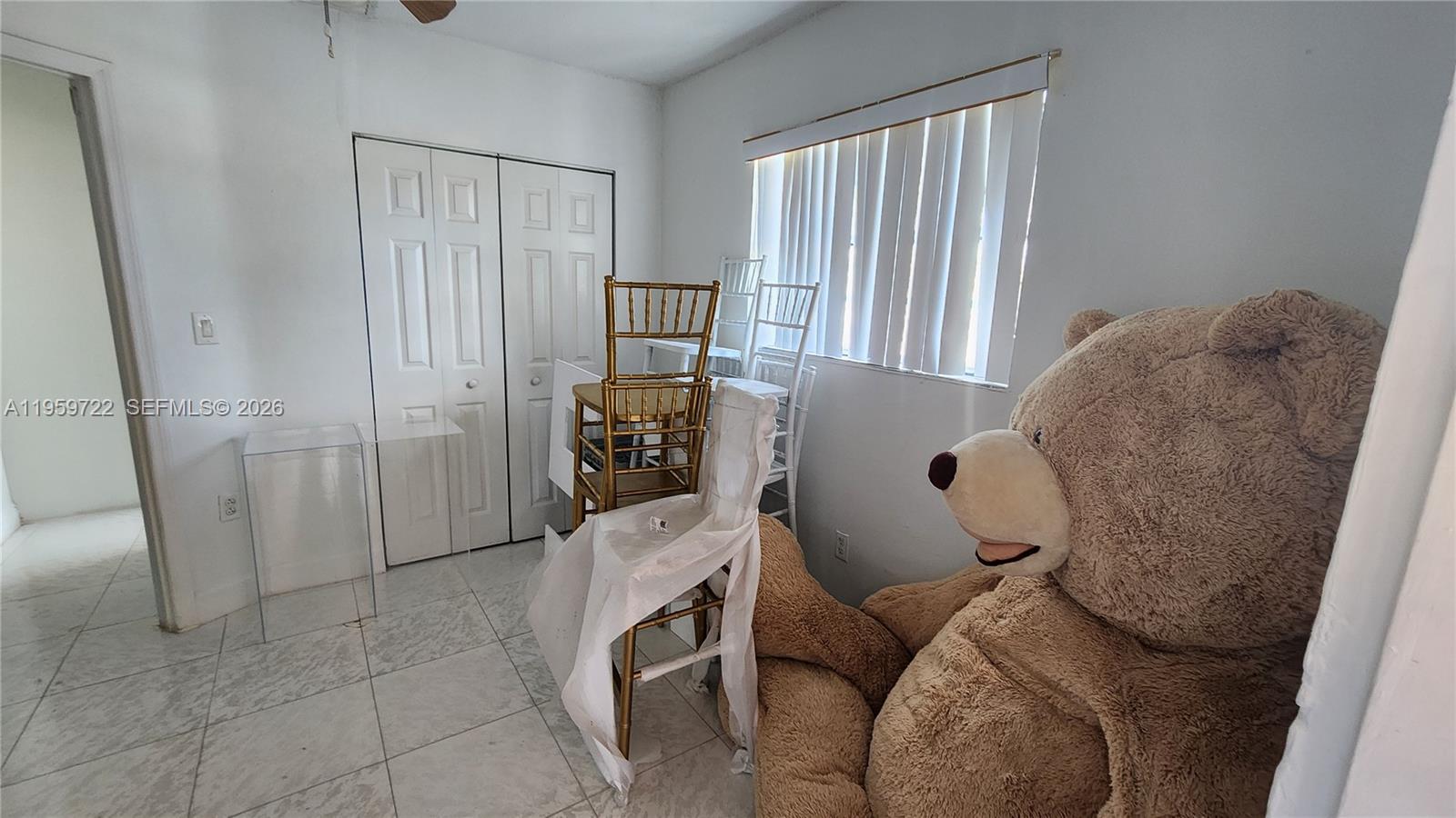 20022 Southwest 118th Avenue Miami, FL 33177 - Photo 10 of 23 a living room with furniture and a window