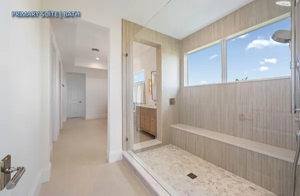 a bathroom with a tub shower and sink