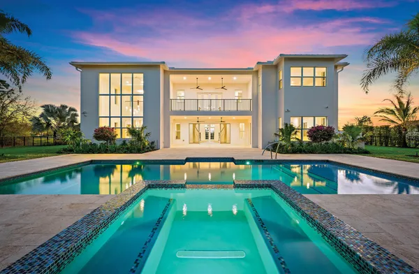 a view of swimming pool with a yard