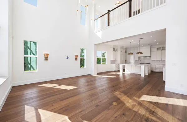 a view interior of a house wooden floor and a kitchen