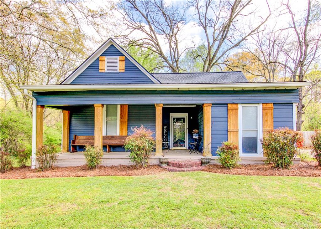 226 Mill Street Bowdon, GA 30108 - Photo 1 of 62 a front view of a house with a yard