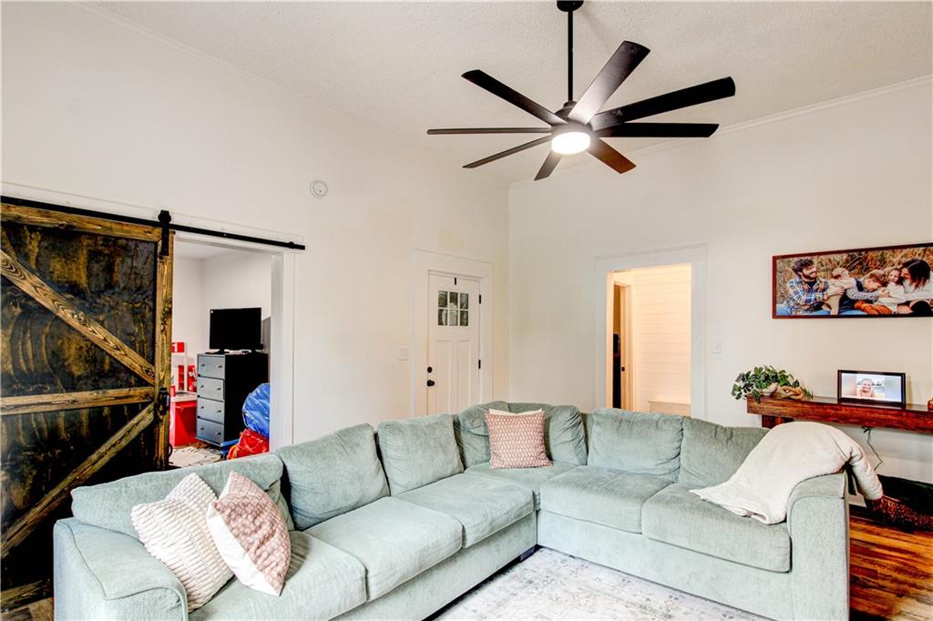 226 Mill Street Bowdon, GA 30108 - Photo 18 of 62 a living room with furniture and a fan