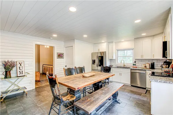 a bathroom with a tub and shower