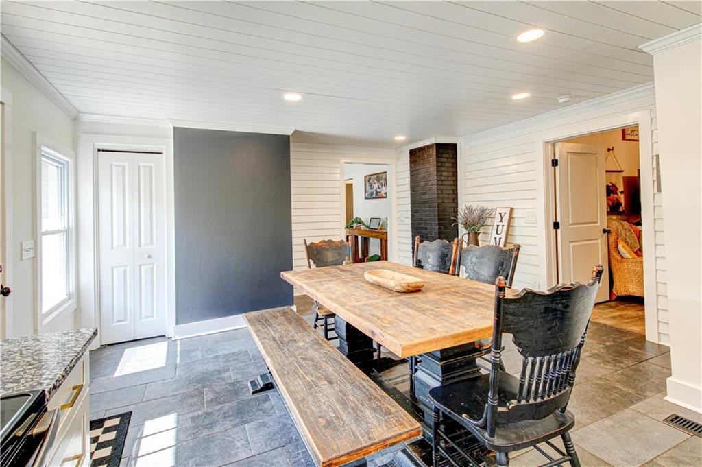 226 Mill Street Bowdon, GA 30108 - Photo 28 of 62 a dining room with furniture and window