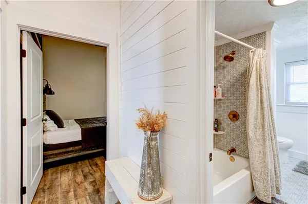 a bedroom with bed and a window