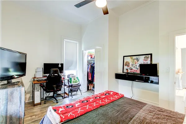 a bedroom with a bed and a window