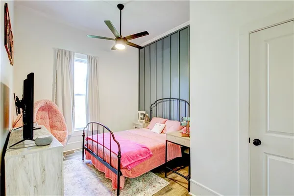 a kitchen with a refrigerator a sink and a stove top oven