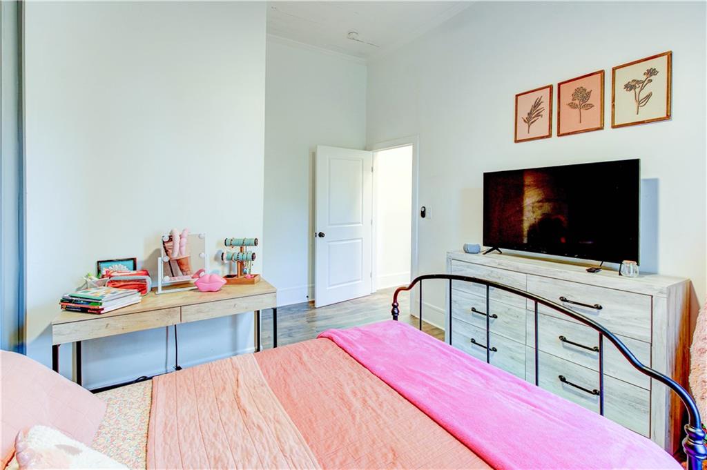 226 Mill Street Bowdon, GA 30108 - Photo 35 of 62 a bedroom with a bed and a flat screen tv