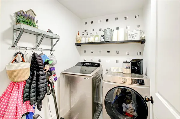 a view of a house with a yard and trees