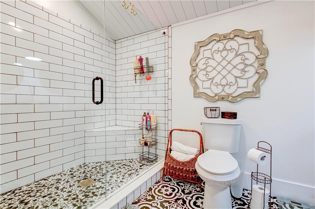 226 Mill Street Bowdon, GA 30108 - Photo 47 of 62 a bathroom with a toilet sink and shower