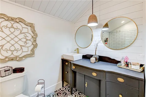 a view of a patio with a table chairs and wooden floor