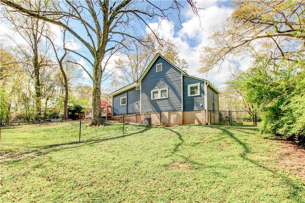 226 Mill Street Bowdon, GA 30108 - Photo 50 of 62 a view of a house with a yard and trees