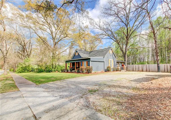 a big house with trees in front of it