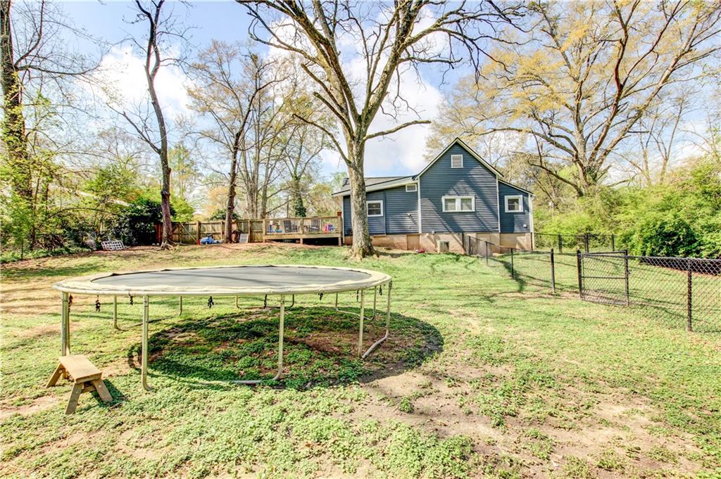 226 Mill Street Bowdon, GA 30108 - Photo 52 of 62 a view of a house with swimming pool and a yard