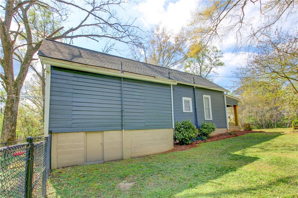 226 Mill Street Bowdon, GA 30108 - Photo 53 of 62 a view of a backyard with plants and large tree