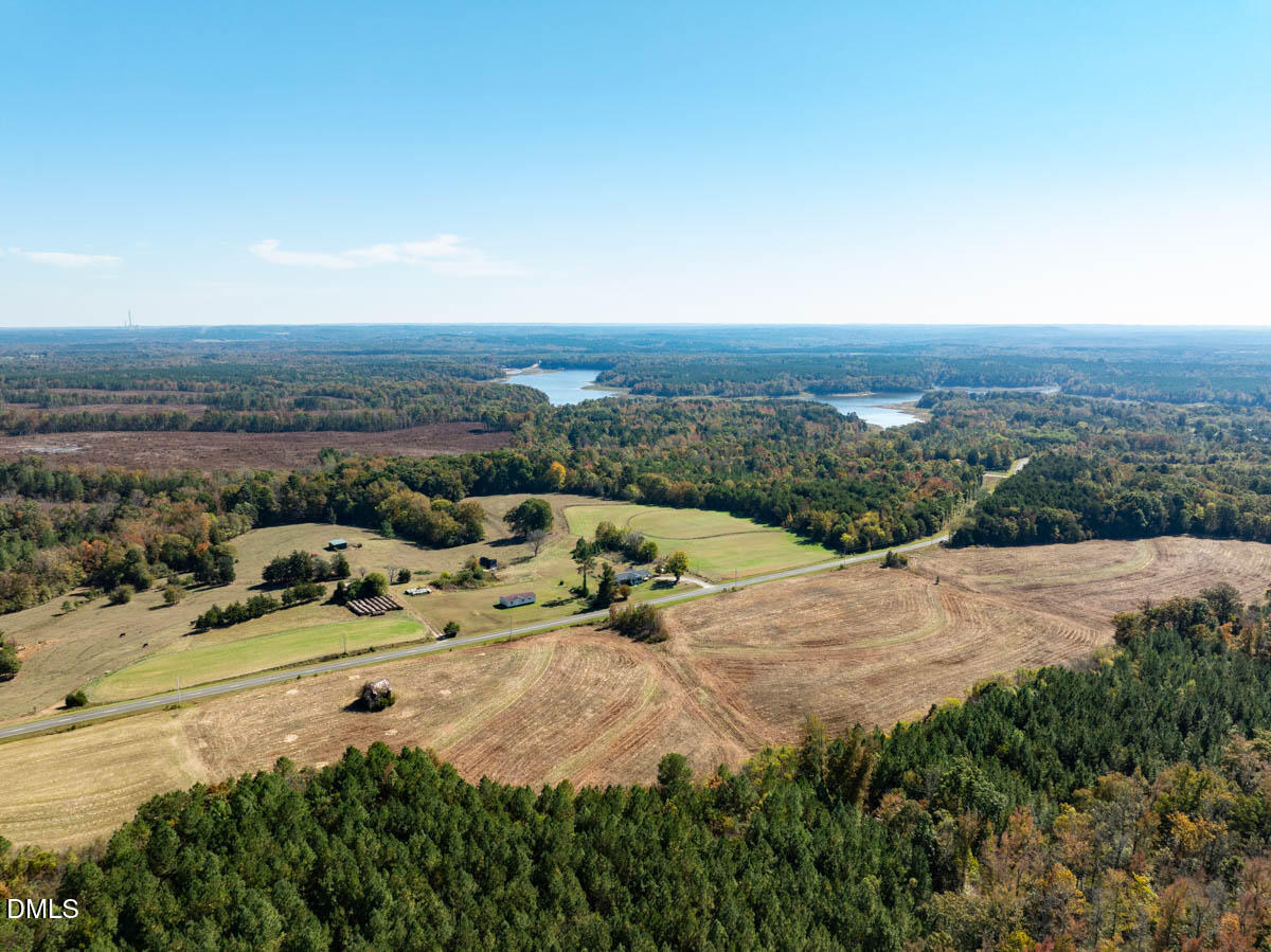 0 Ephesus Church Road Semora, NC 27343 - Photo 21 of 45 an aerial view of a houses with a yard and lake view