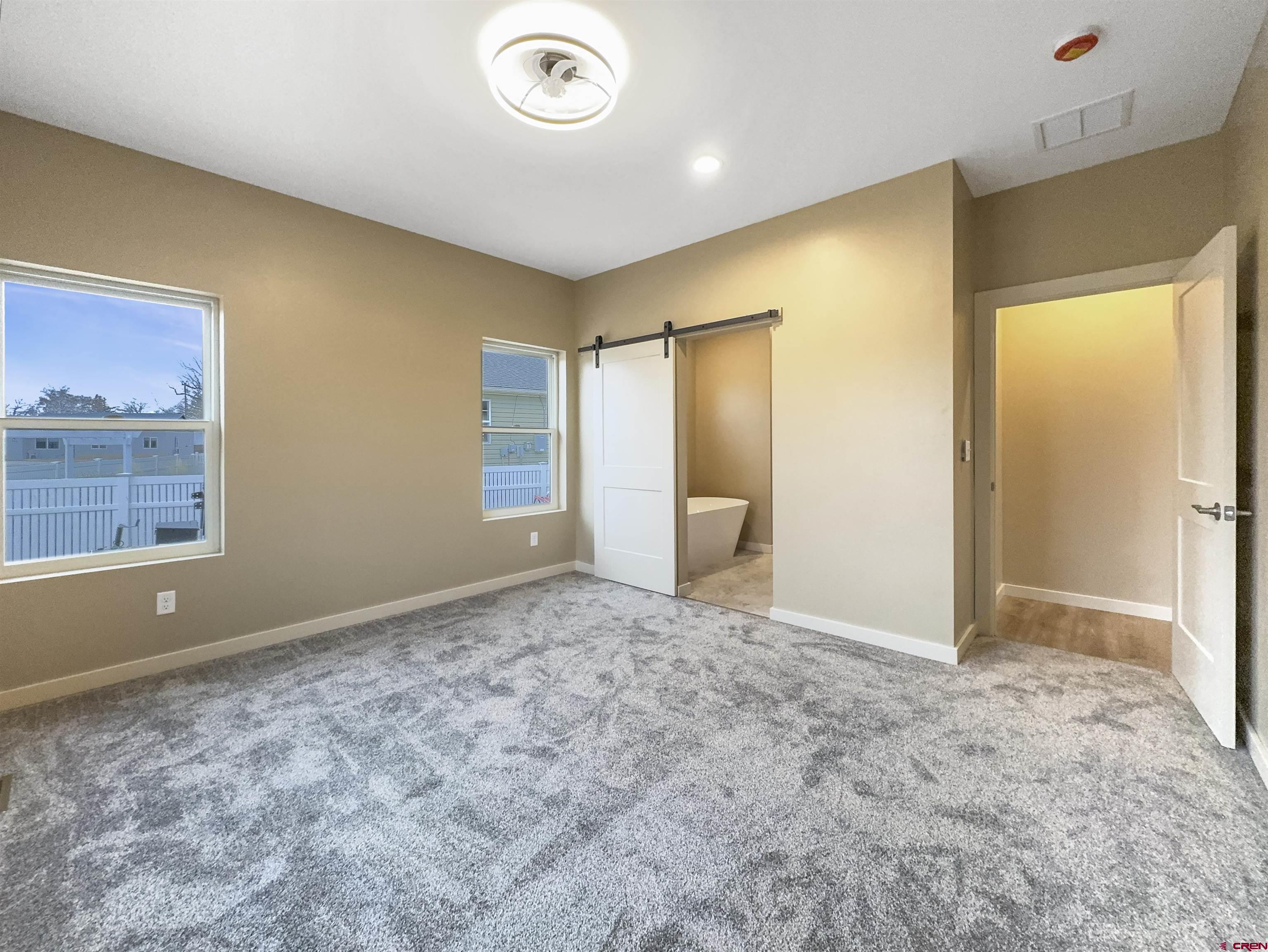 511 Juniper Place Cortez, CO 81321 - Photo 17 of 36 a view of an empty room and window