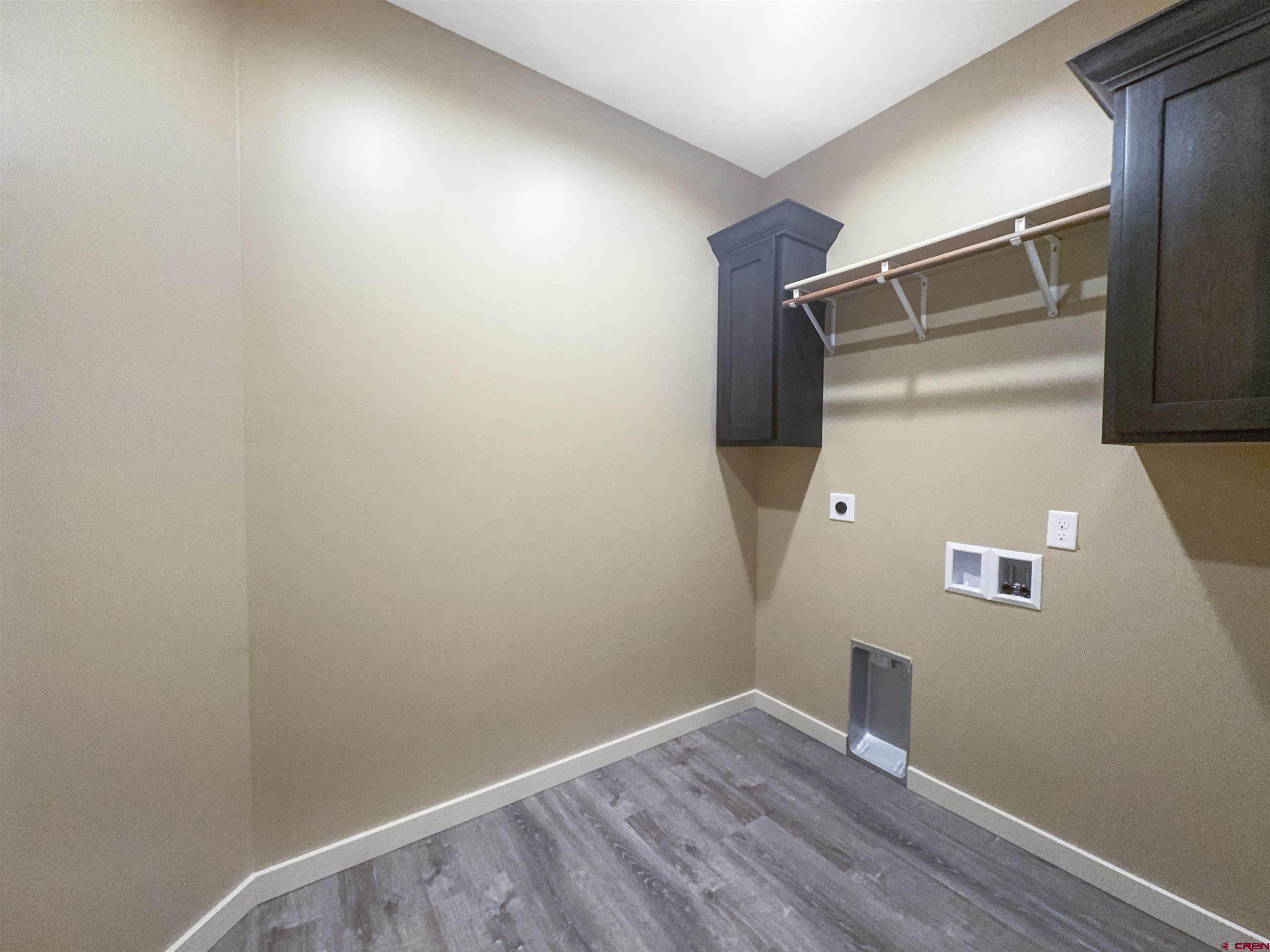 511 Juniper Place Cortez, CO 81321 - Photo 26 of 36 a view of walk in closet with wooden floor