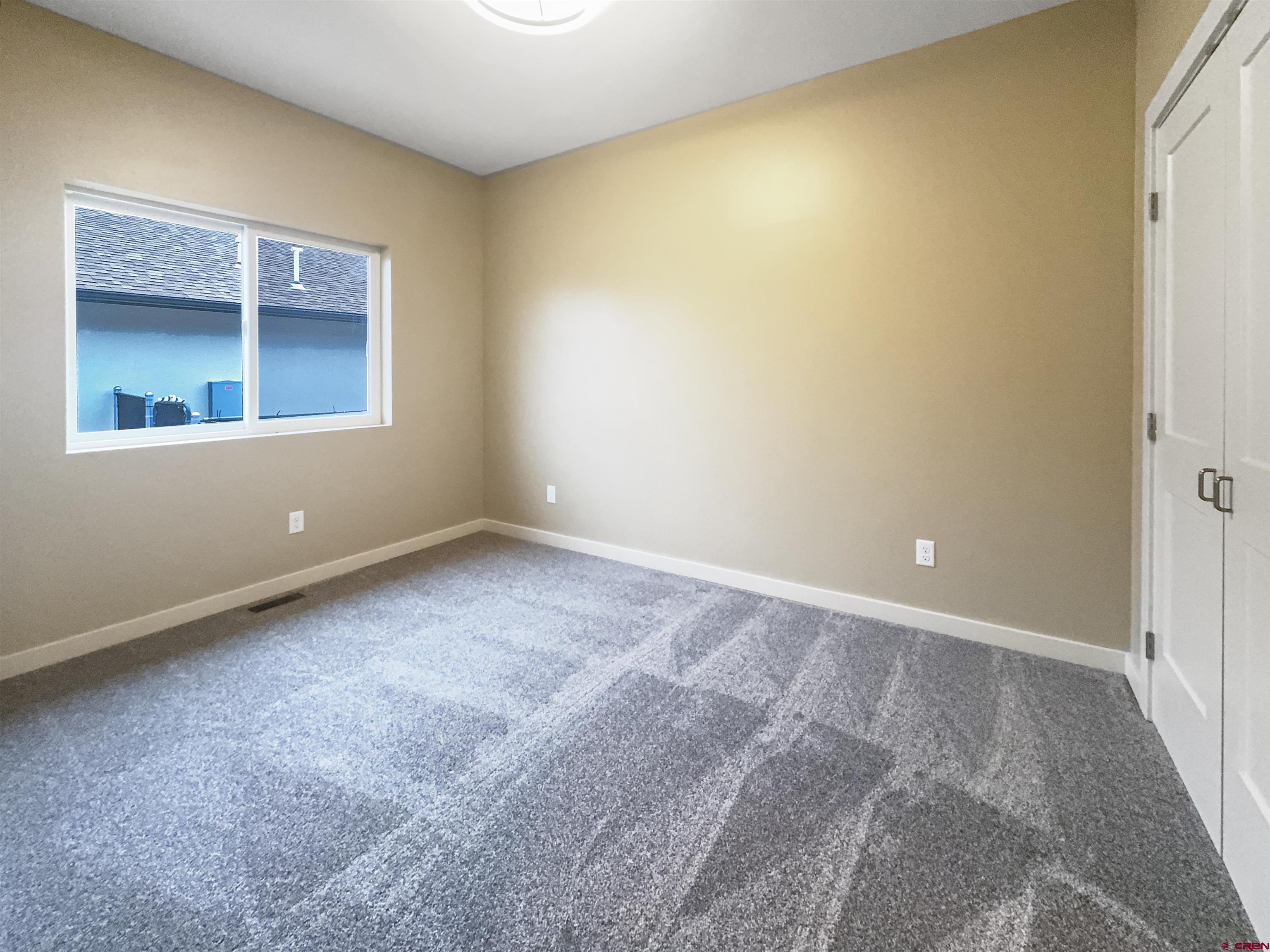 511 Juniper Place Cortez, CO 81321 - Photo 28 of 36 a view of an empty room with a window