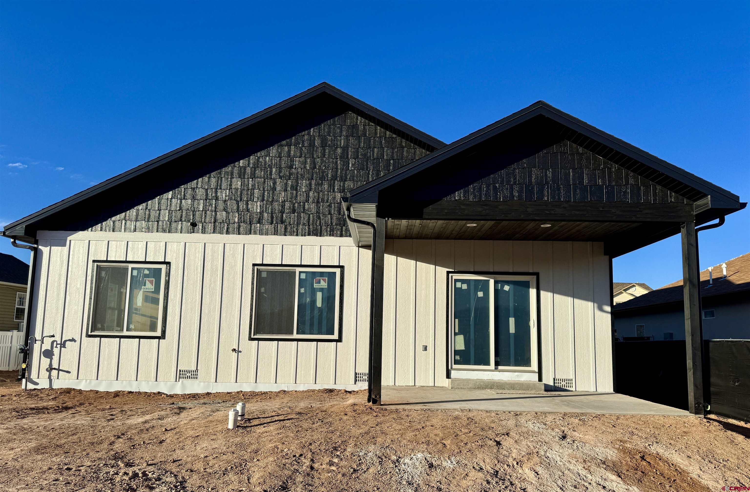 511 Juniper Place Cortez, CO 81321 - Photo 33 of 36 a front view of a house with a porch