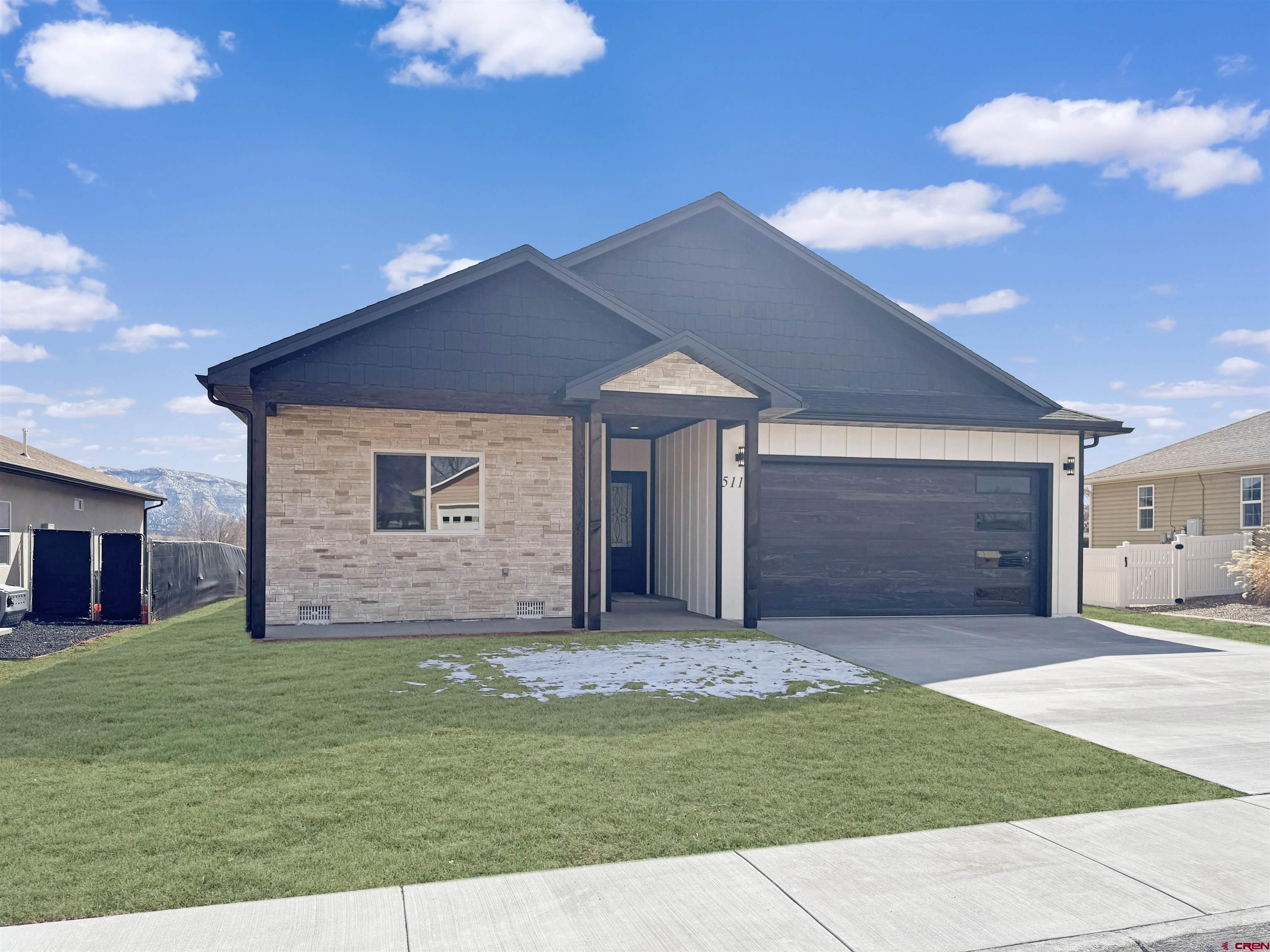 511 Juniper Place Cortez, CO 81321 - Photo 4 of 36 a view of a house with a yard