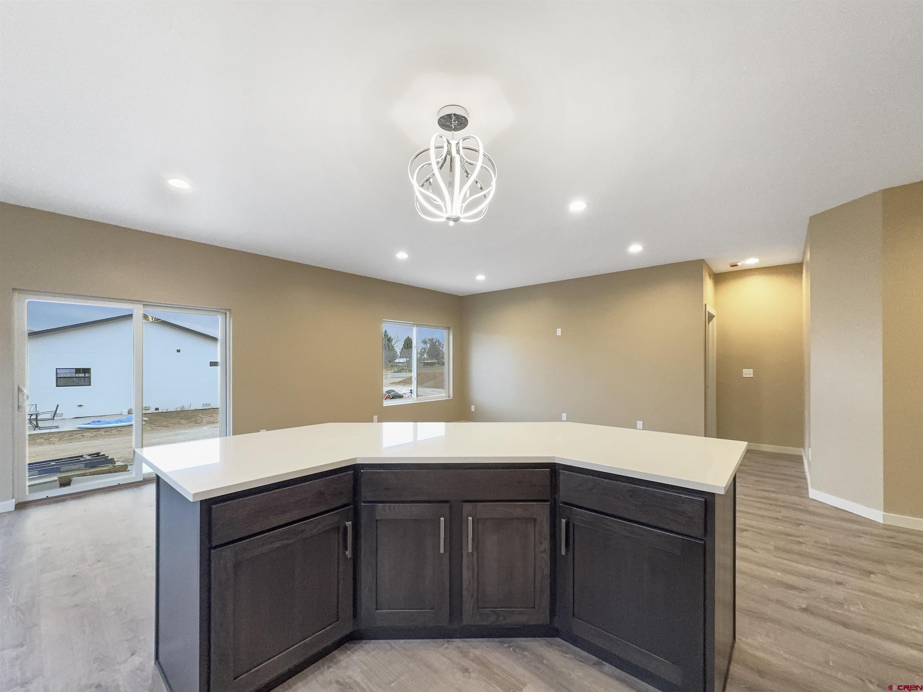 511 Juniper Place Cortez, CO 81321 - Photo 7 of 36 a kitchen with a sink and cabinets