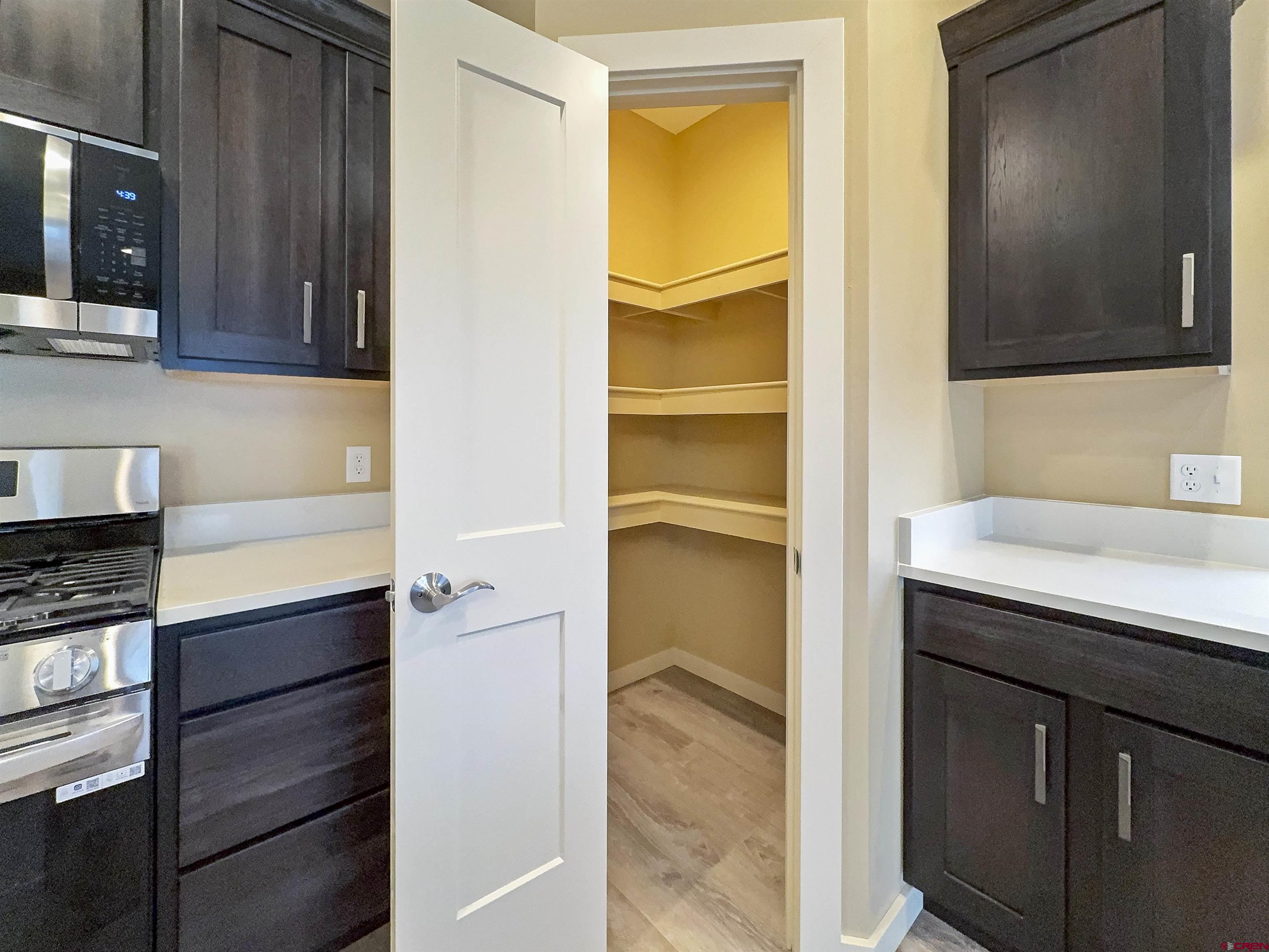 511 Juniper Place Cortez, CO 81321 - Photo 9 of 36 a kitchen with a sink and a refrigerator