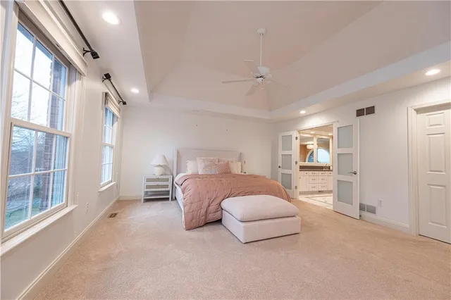 a bedroom with a bed and a cabinets