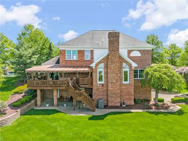 a front view of a house with a yard and porch