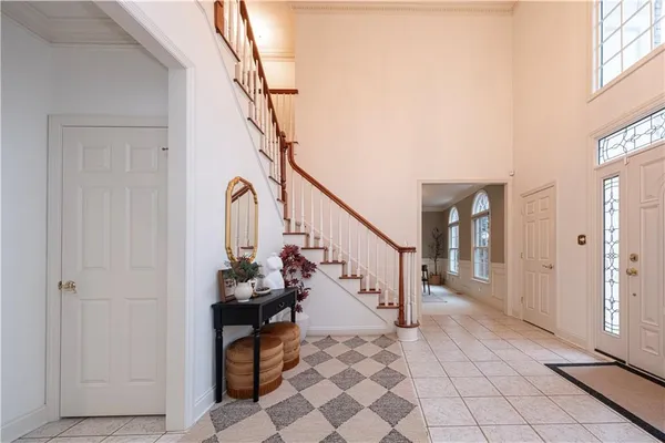a view of entryway and hall with a front door
