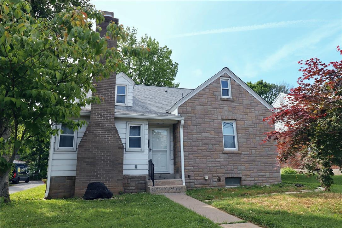 172 Harrison Street Emmaus, PA 18049 - Photo 1 of 30 A charming exterior with a striking brick chimney and stone accent walls, nestled amongst mature trees.