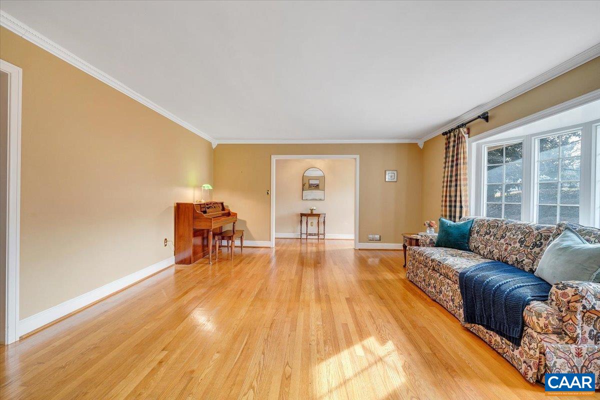 3558 Hartland Road Southwest Roanoke, VA 24015 - Photo 11 of 73 a living room with furniture and a wooden floor