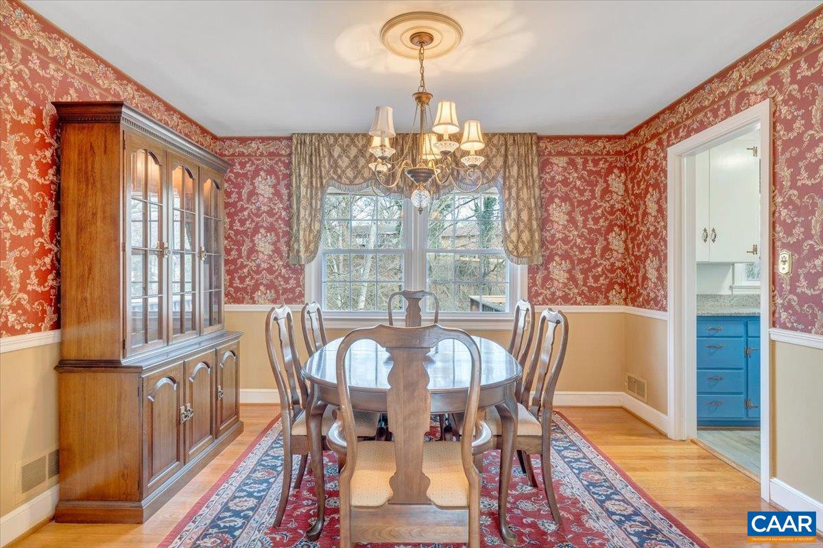 3558 Hartland Road Southwest Roanoke, VA 24015 - Photo 13 of 73 a view of a dining room with furniture wooden floor and chandelier