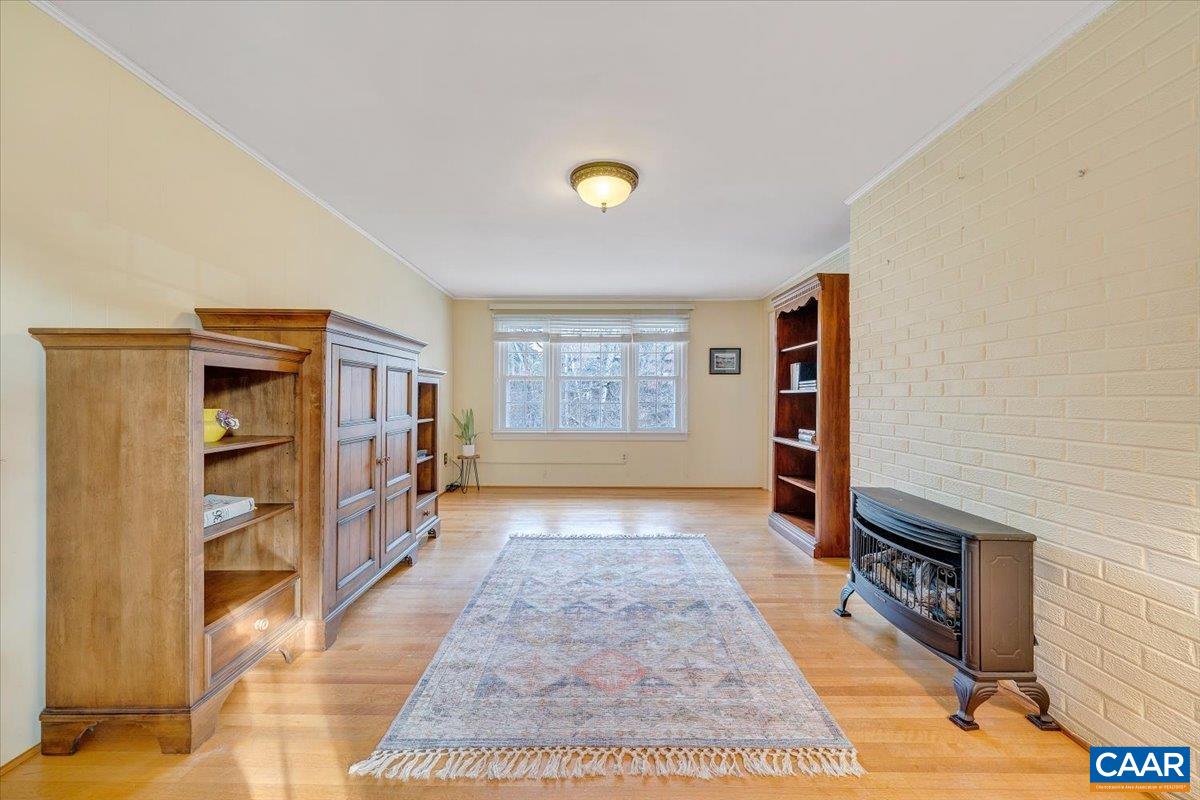 3558 Hartland Road Southwest Roanoke, VA 24015 - Photo 22 of 73 a view of an empty room with window and a kitchen