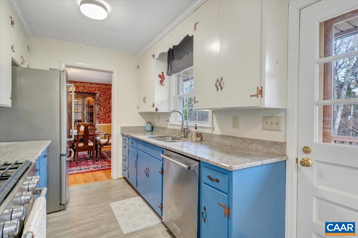 3558 Hartland Road Southwest Roanoke, VA 24015 - Photo 30 of 73 a kitchen with stainless steel appliances granite countertop a sink stove and cabinets