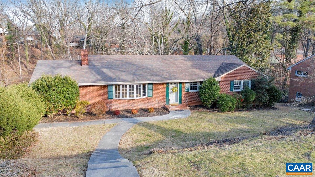 3558 Hartland Road Southwest Roanoke, VA 24015 - Photo 3 of 73 a front view of a house with a yard and a garden