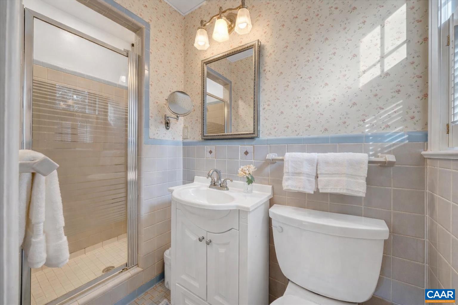 3558 Hartland Road Southwest Roanoke, VA 24015 - Photo 35 of 73 a bathroom with a toilet sink and mirror