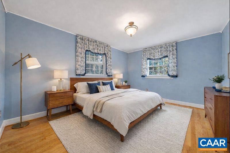3558 Hartland Road Southwest Roanoke, VA 24015 - Photo 36 of 73 a bedroom with a bed and a lamp on table